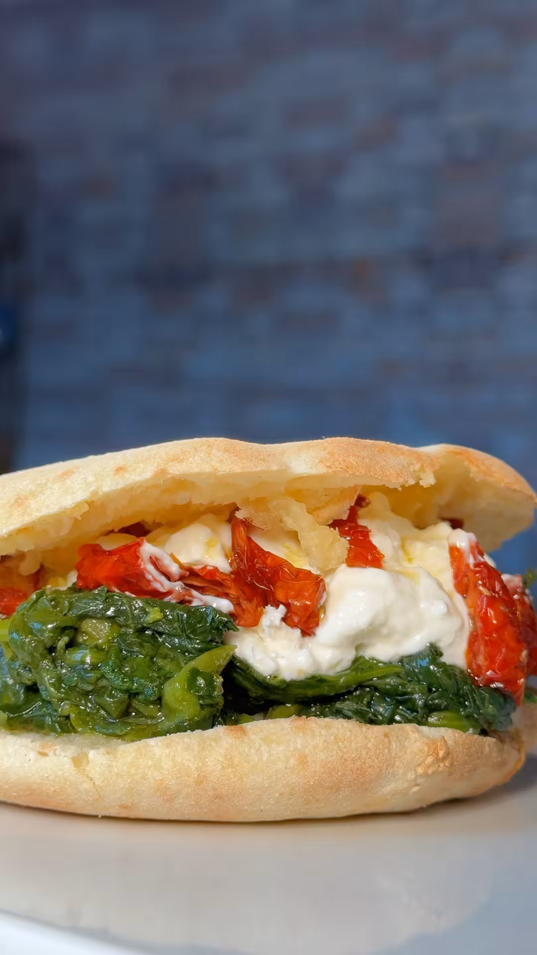 Stuffed Salentina Puccia: Recipe with Turnip Greens, Burrata, and Sun-Dried Tomatoes